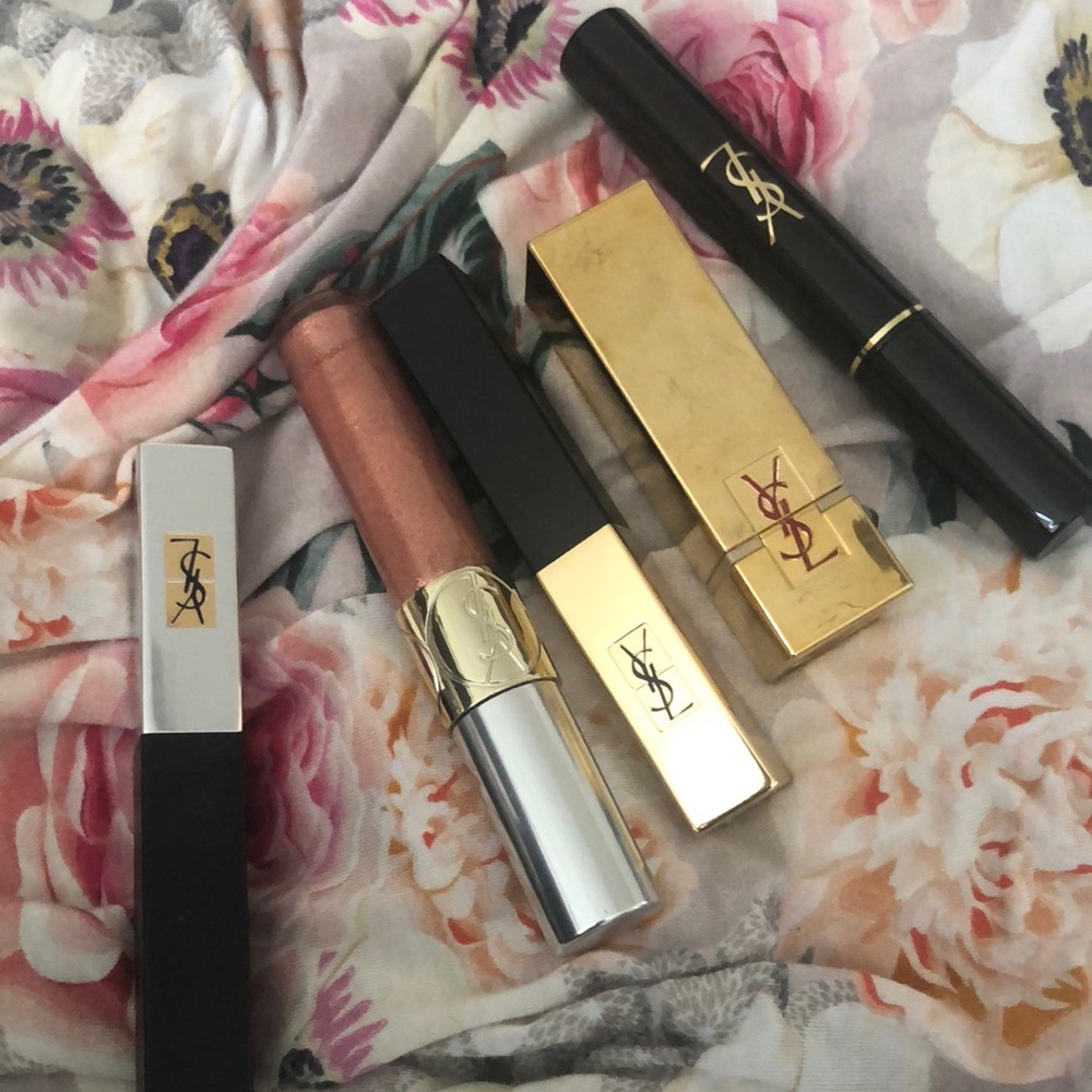 Lot of random YSL make up including lipstick, gloss and brow gel
